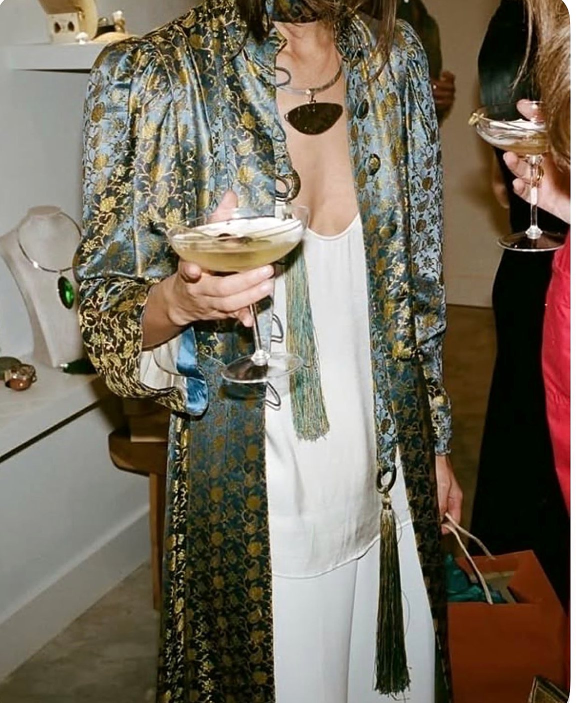Silk brocade coat over a white slip dress